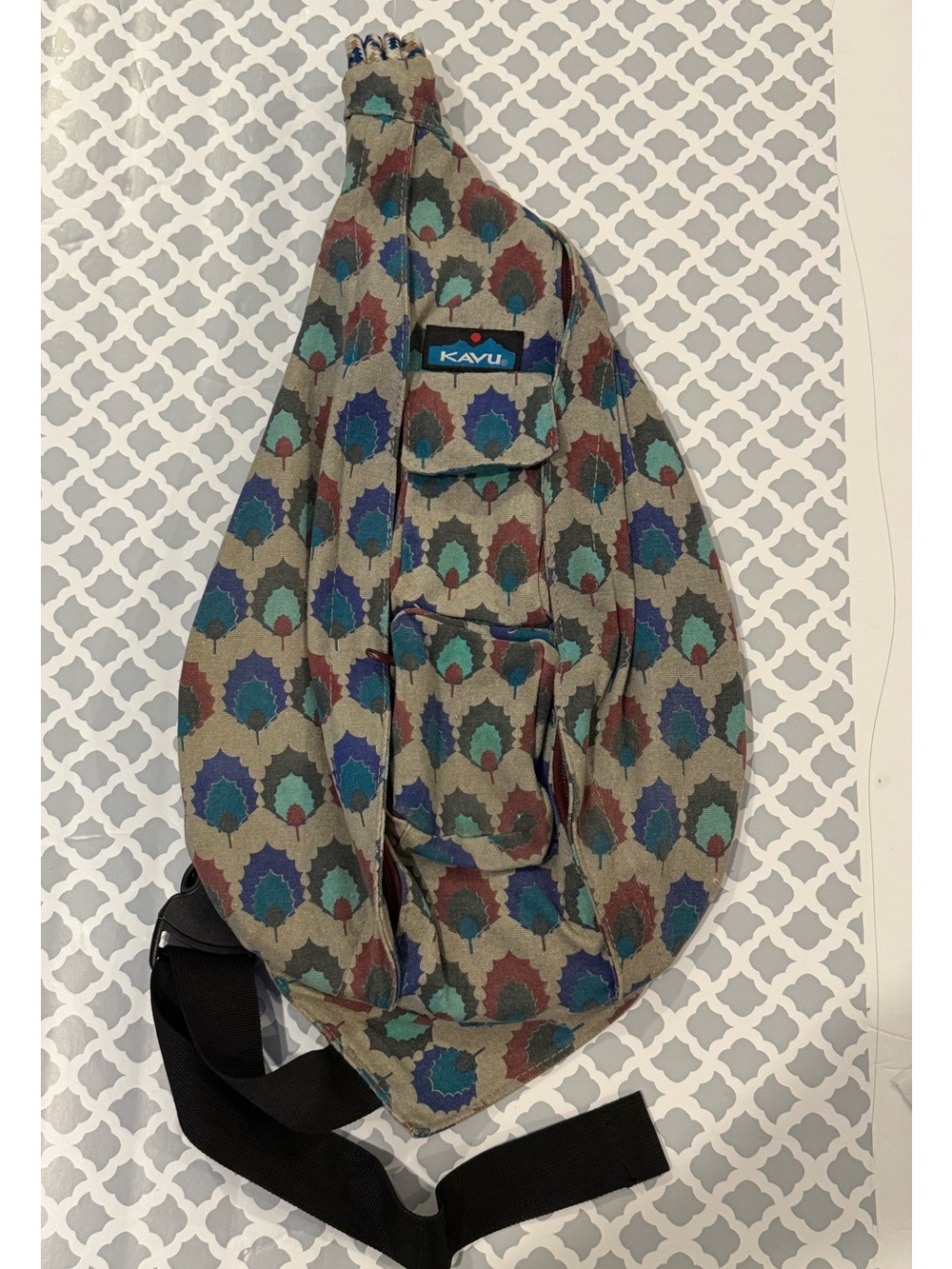 Kavu Patterned Rope Sling Bag in Teal, Olive & Rust